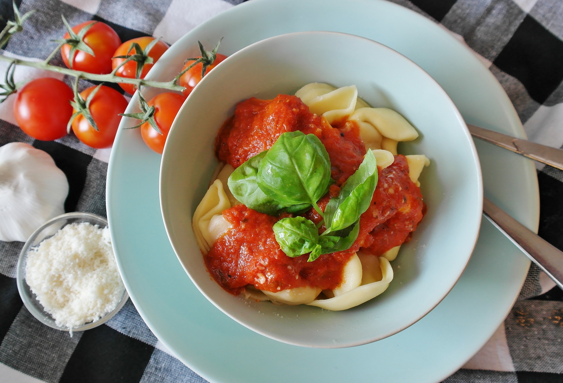 Bowl of pasta on top of plate