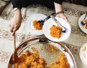 Serving chicken biryani